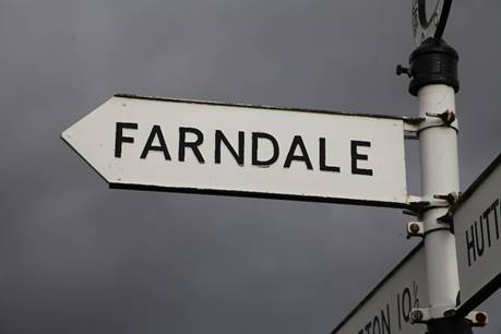 A white sign with black text
Description automatically generated